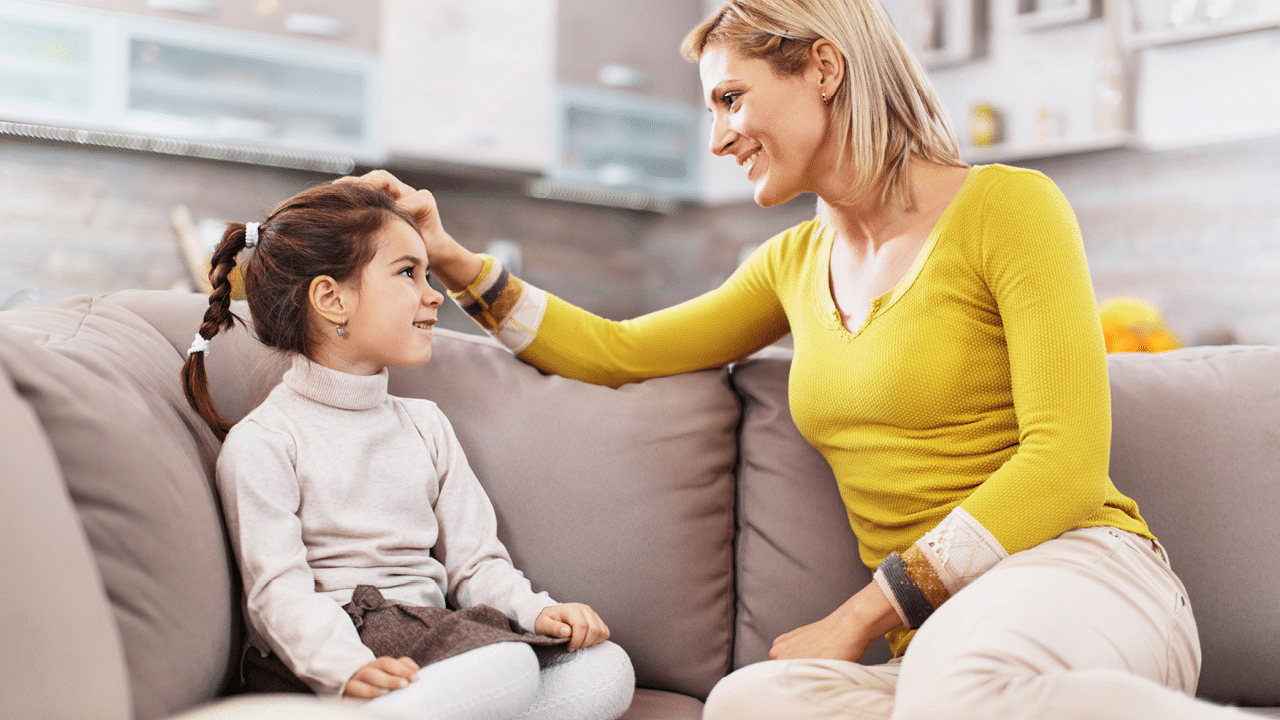 A kid talking to her mom