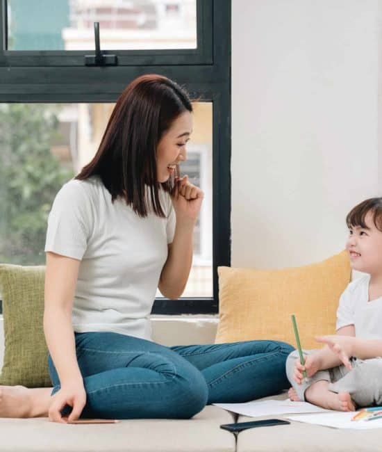 young Asian mother and daughter at home