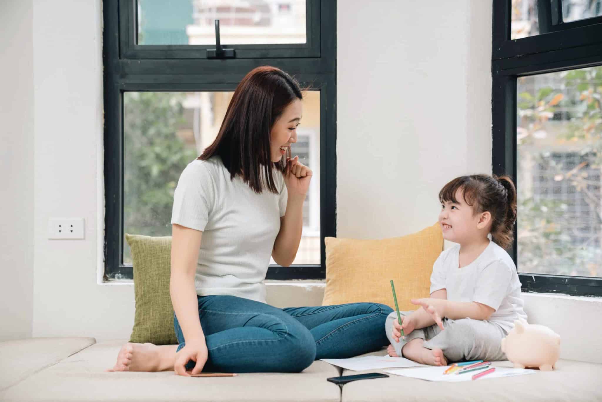 young Asian mother and daughter at home