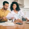 Couple, insurance paperwork and budget planning with laptop, bills and finance with taxes and mortgage. Financial documents, payment and loan with policy, audit and review with asset management