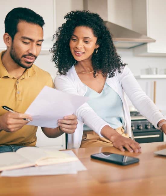 Couple, insurance paperwork and budget planning with laptop, bills and finance with taxes and mortgage. Financial documents, payment and loan with policy, audit and review with asset management